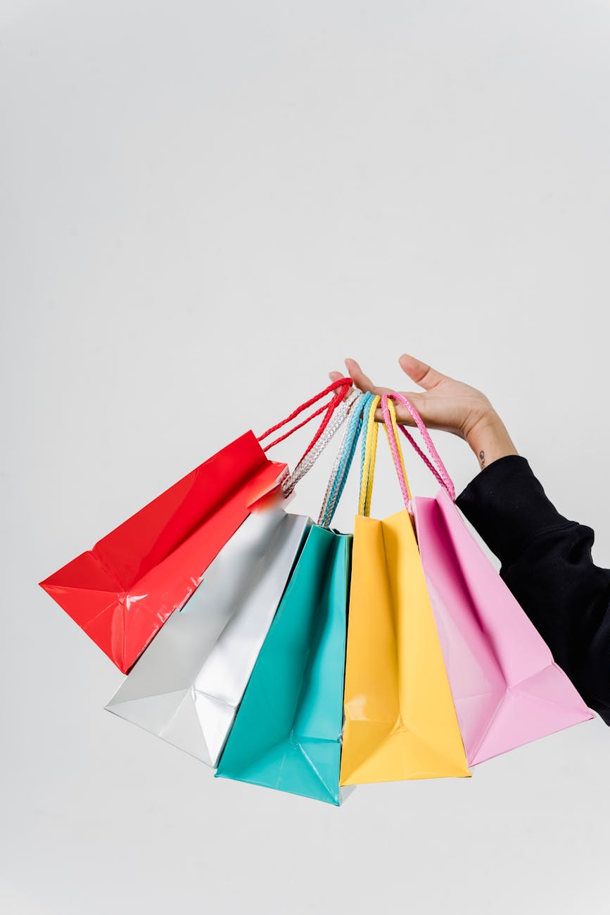 a person holding variety of shopping bags